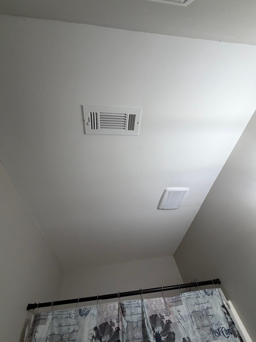 Bathroom ceiling finish around the ventilation grilles