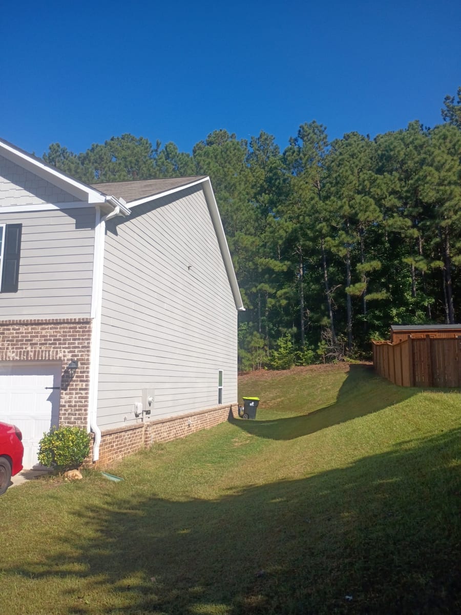 Light exterior siding with white gable trim
