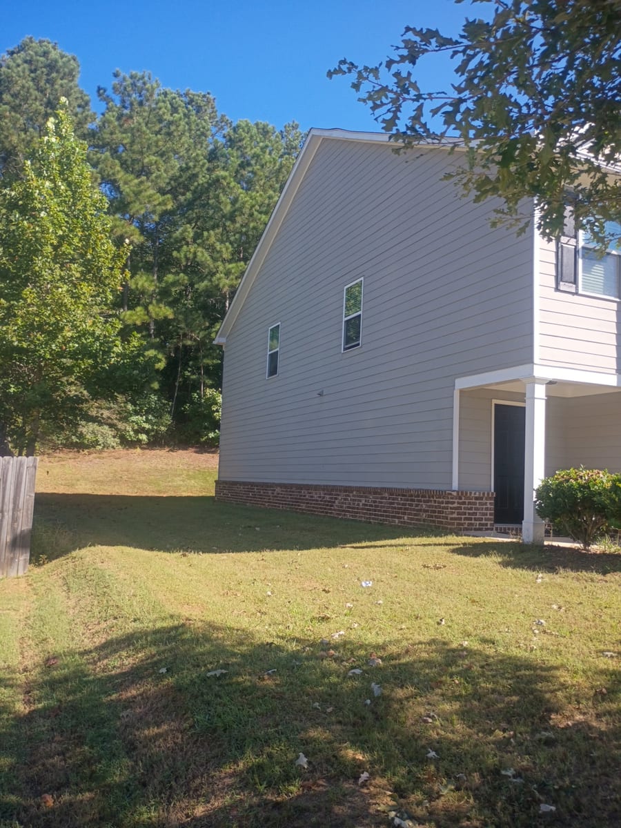 Another elevation showing exterior siding and white trim